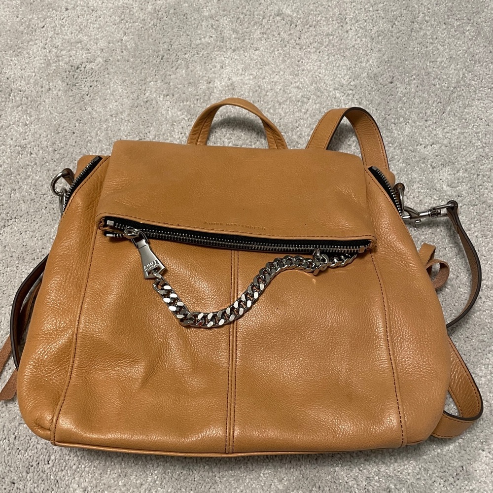 Tan Aimee Kestenberg leather backpack with silver hardware.
